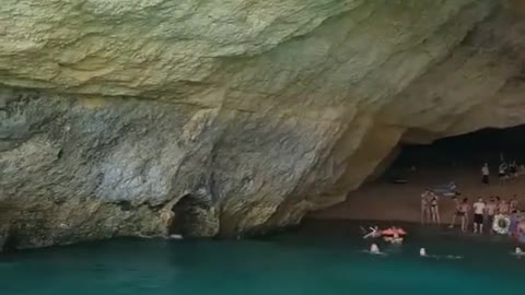 This car seems to be going into the beautiful sea.