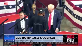 Trump Pulls Local Artist Up on Stage to Sign His Painting of the Assassination Attempt Iconic Photo