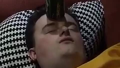 Can balanced on sleeping man's head