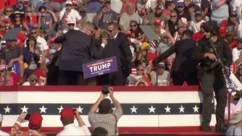 Donald Trump slowly moved off stage after apparent shots fired at his rally