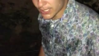 Guy in paisley shirt cracks beer over head and chugs it