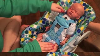 Adorable Baby Carter tries new Doll