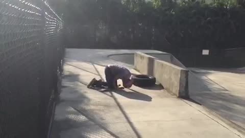 Skateboard tire jump runs into fence