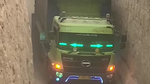dump truck passing through narrow streets