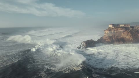 Large waves crashing on the rocky shore