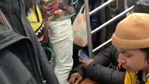 Guy raps out loud on subway train and everyone is pissed