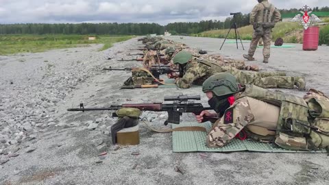 Military personnel study the theoretical foundations of sniper business
