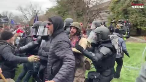 Ttrump supporters protecting police.