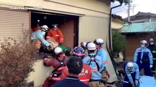 Elderly woman under collapsed home rescued in Japan