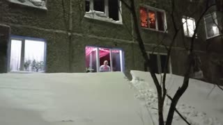 Moment Kids Slide Down Snow Drift From 1st-Floor Window