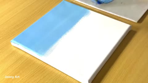 Paint A Light Blue Background On A White Cloth