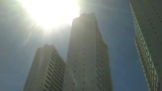 3 skyscrapers get all the heat from a big summer sun, the buildings are big [Nature & Animals]