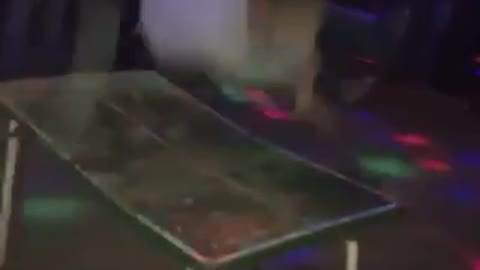 Girl drops elbow on table at party