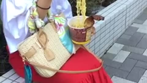 Just eating cup noodles on the street in japan