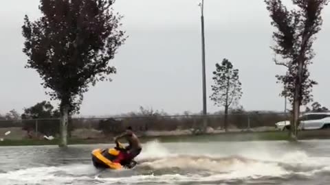 California man jet skis thru neighborhood during Hurricane Hillary