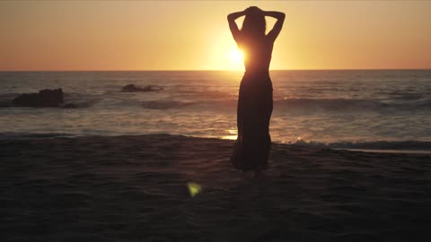 Female silhouette on the beach