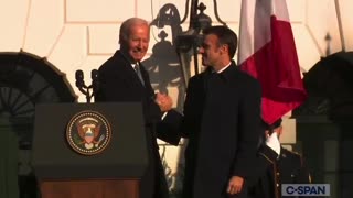 Biden shakes Macron's hand for 40 seconds.