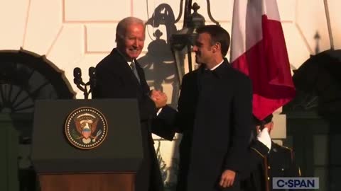 Biden shakes Macron's hand for 40 seconds.