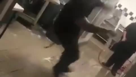 young woman gets excited about cleaning the floor, and ends up falling.