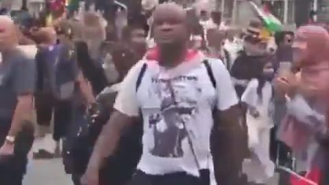 Palestine supporter gives a Nazi salute in Piccadilly Circus during a hate march.