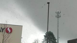 Tornado Debris Floats Through Stormy Sky