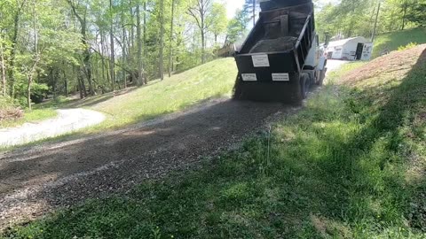 Driveway repair: grading and hauling in road bond.