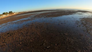 The tide is out. Speedlapse. Walking the beach