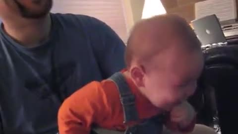 Baby laughing to his heart's content at Nintendo Wii. Laugh is so contagious and cute!!