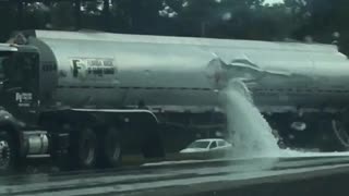 Fuel Tanker Spills its Load onto Highway