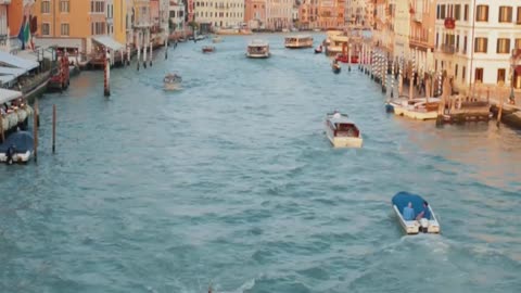 Motor boats with tourists in Venice, Italy