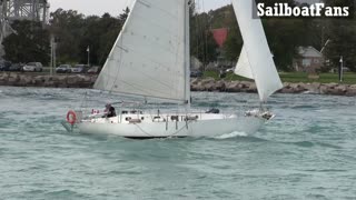 Random White Sailboat Light Cruise Under Bluewater Bridges In Great Lakes