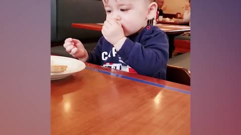 Cute babies eating lemons for the first time.