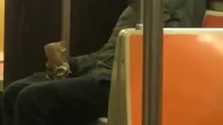 Guy in black smoking on train