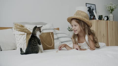 A Girl Looking at the Cat