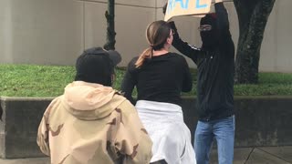 Man Holds "You Deserve Rape Sign" at Women's March