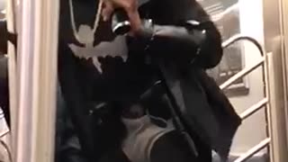 Guy sings shape of you on karaoke microphone on subway train