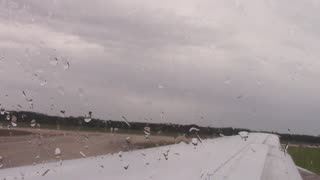 Plane Taking off and landing, aerial view, raining and cloudy, stock footage, creative commons