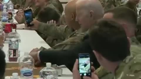 Pres. Biden eats pizza with service members in Rzeszow, Poland