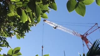 MAN ALMOST FALLS FROM CRANE IN BRISBANE