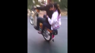 Doing a Wheelie on a Motorbike