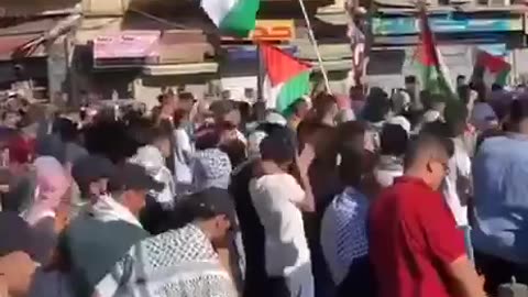 Jordanian and Lebanese with Palestinian flags marching towards Israel after Day of Jihad call