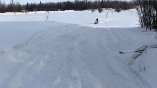 Accidental Superman on a Snowmobile