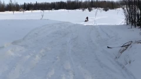 Accidental Superman on a Snowmobile