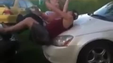 Guy jumps on car hood faceplant