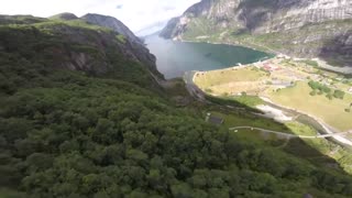 POV wingsuit BASE jump filmed in Norway