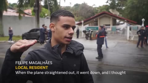 Witnesses react after plane crashes with 61 people aboard in Brazil's Sao Paulo state.mp4