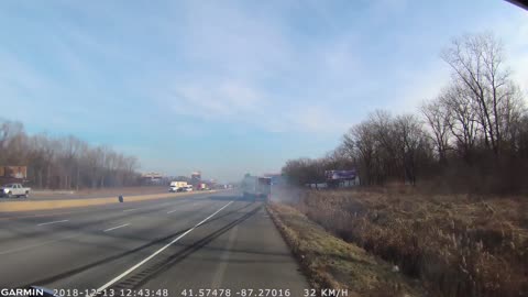 Car Sandwiched Between Semi and Concrete Barrier