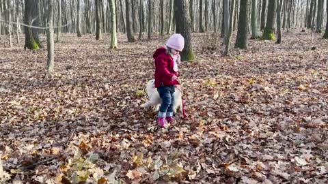 Cute_Baby_With_Puppy_Walking_in_the_Forest_for_the_First_Time