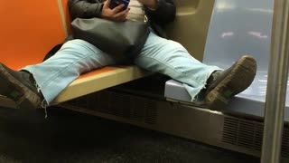 Woman on subway spreads legs across four chairs at once