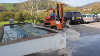Man Turns Car Park Into Car Pond With His Forklift